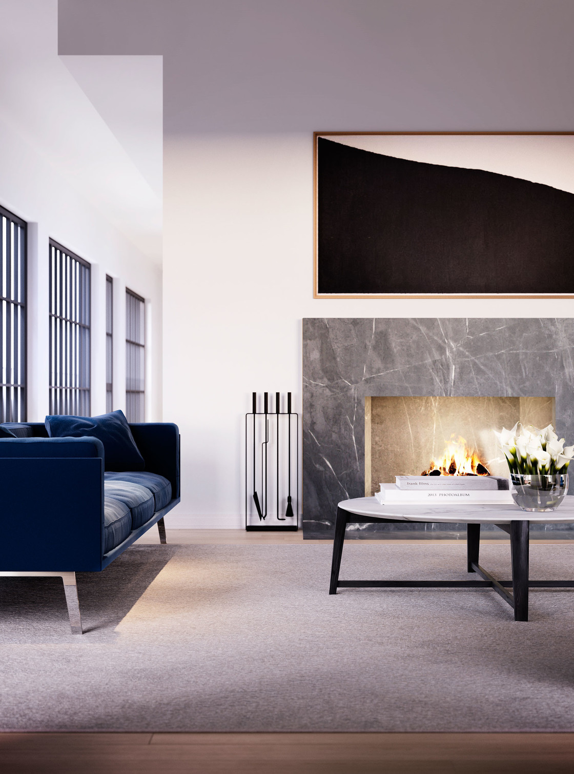 The penthouse’s spacious living room is a great place to gather in all seasons. The room is anchored by a modern fireplace that becomes the focal point during the colder months. And in the summer, the nearby terrace doors can be opened to welcome fresh air and light.